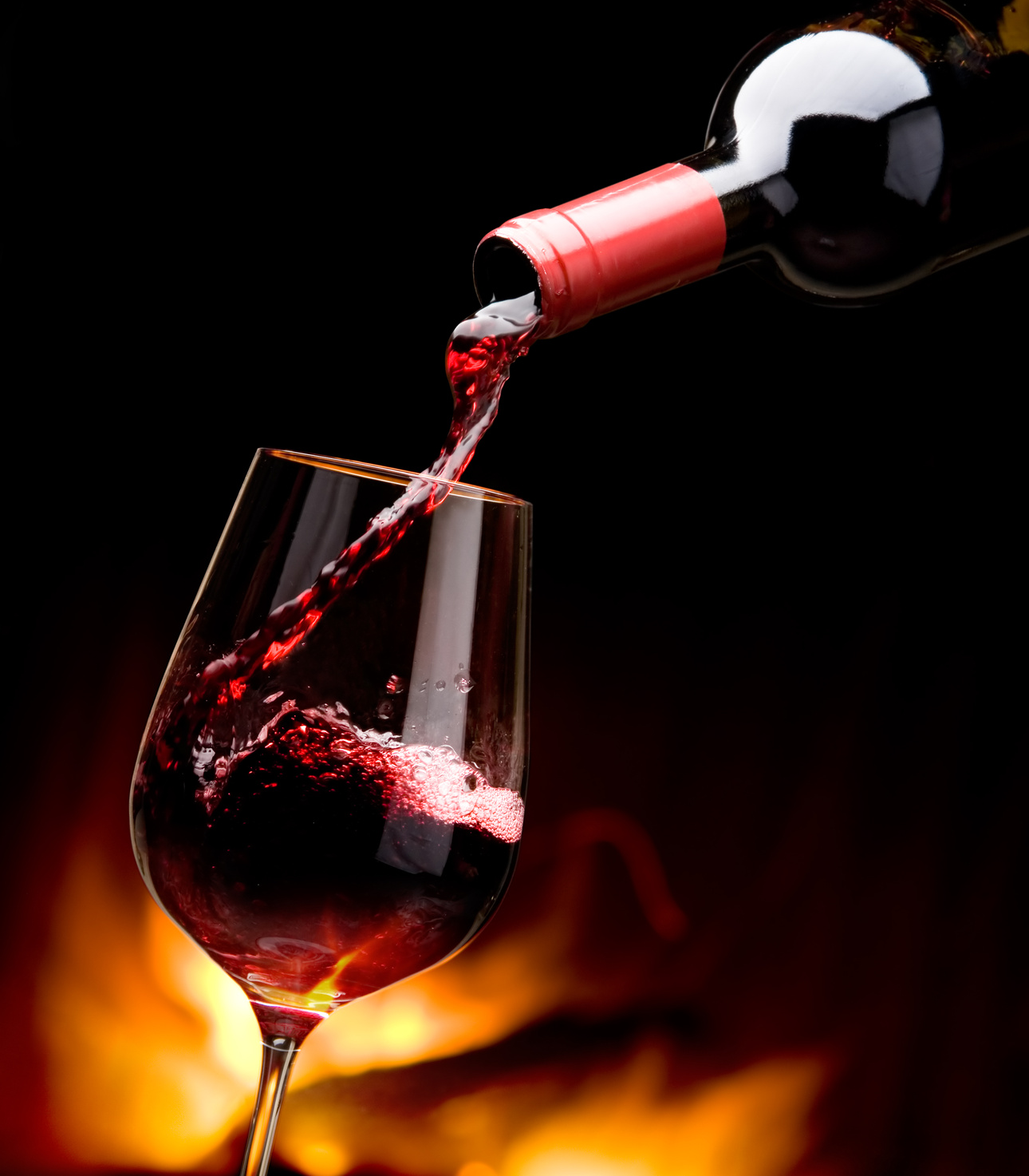 pouring wine by the fireplace